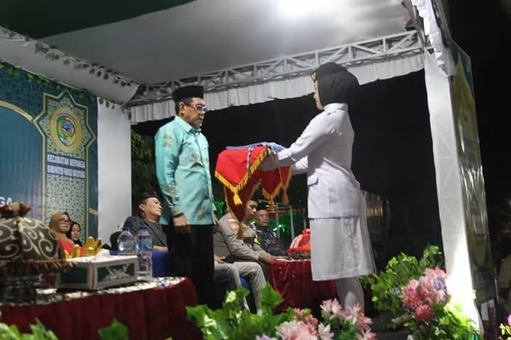 Bupati H. Erwin Burase Resmikan MTQ Ke-17 Kecamatan Mepanga di Desa Kayu Agung : Al Qur'an Sebagai Pedoman Moral dan Pengingat Kewaspadaan Bencana